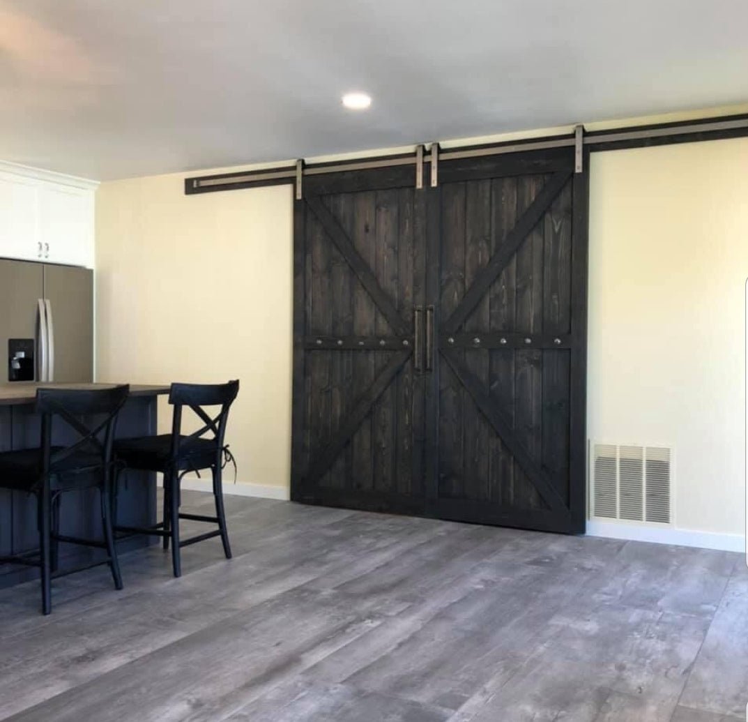 Kitchen area showcasing the Custom Double British Brace K Style Barn Door
